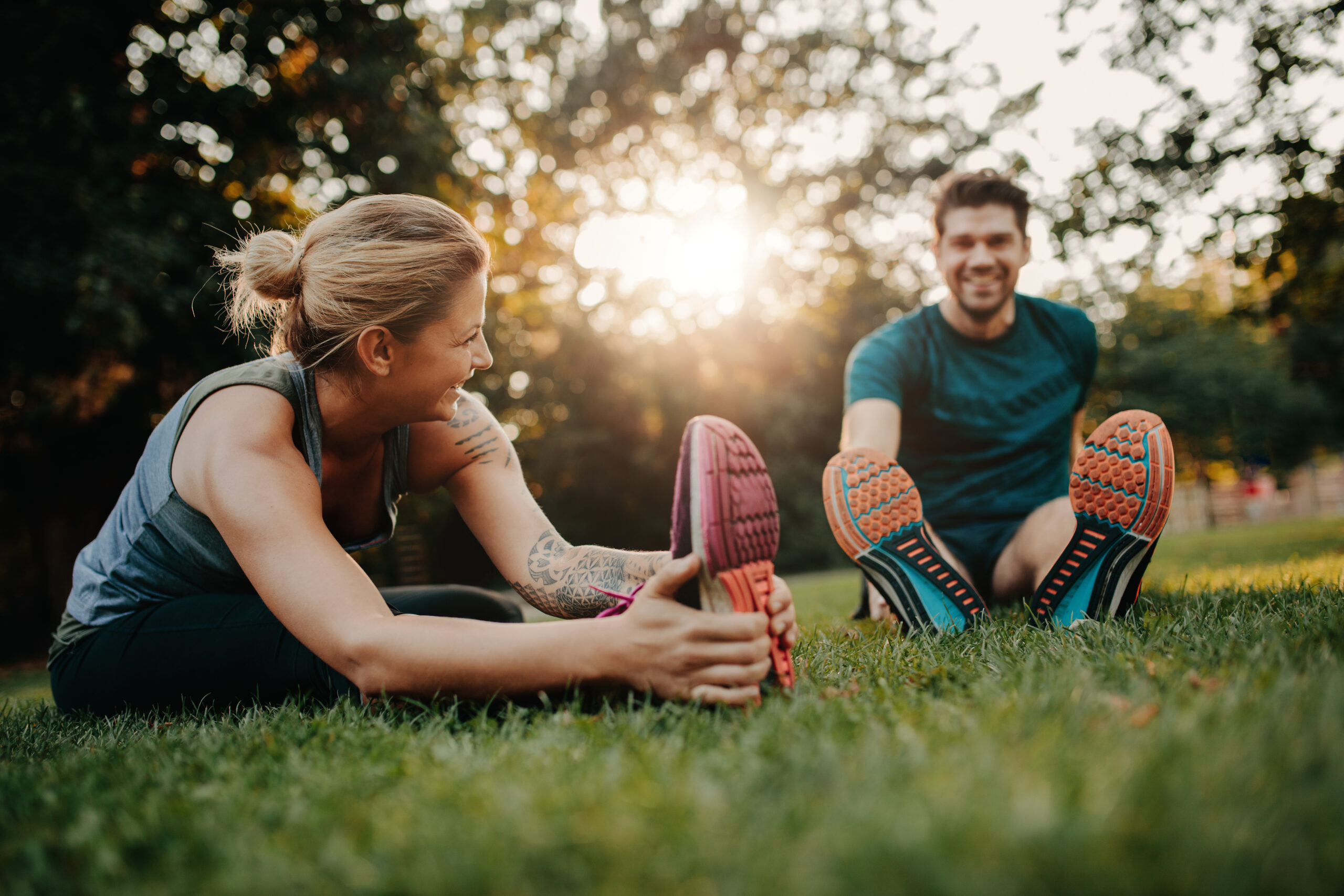 two people stretching